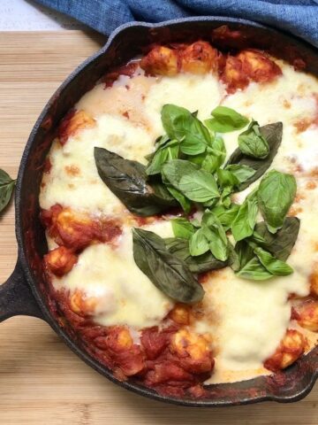 Birds eye view of baked gnocci in skillet