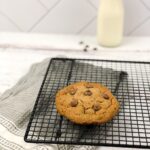 Chocolate chip cookie on cooling rack