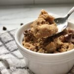 Close up mug cake in ramekin with teaspoon